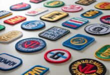 A number of embroidered patches placed on a white surface.